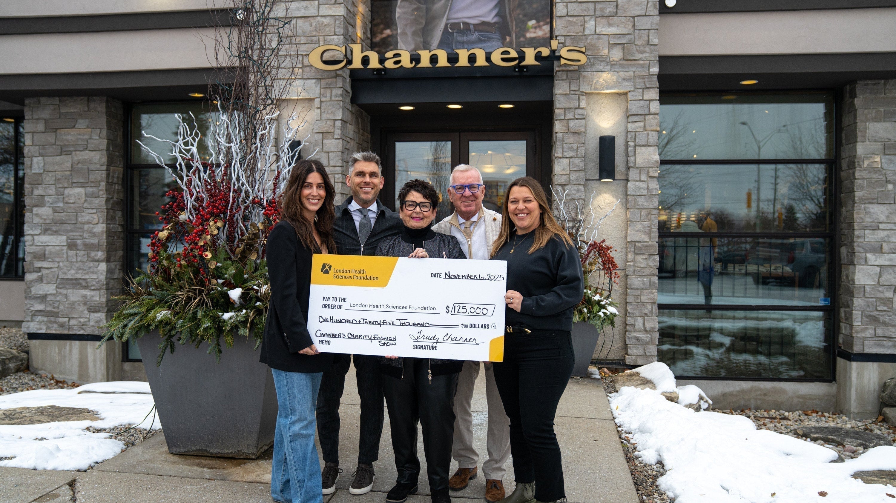 Channer's Team with check form charity event