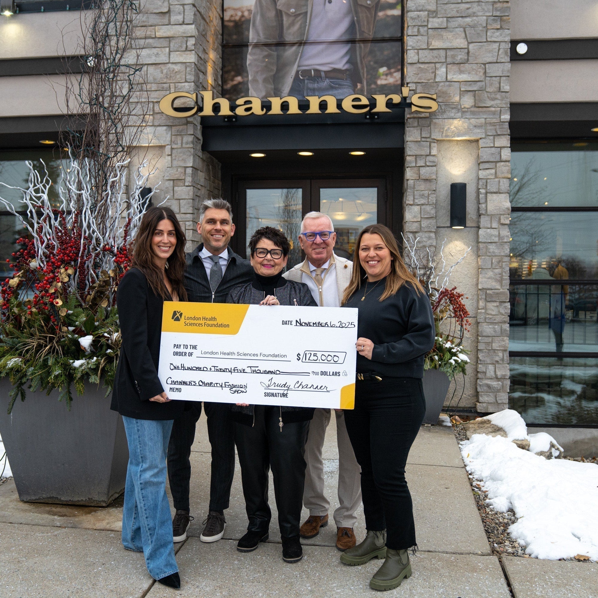 Channer's Team with check form charity event