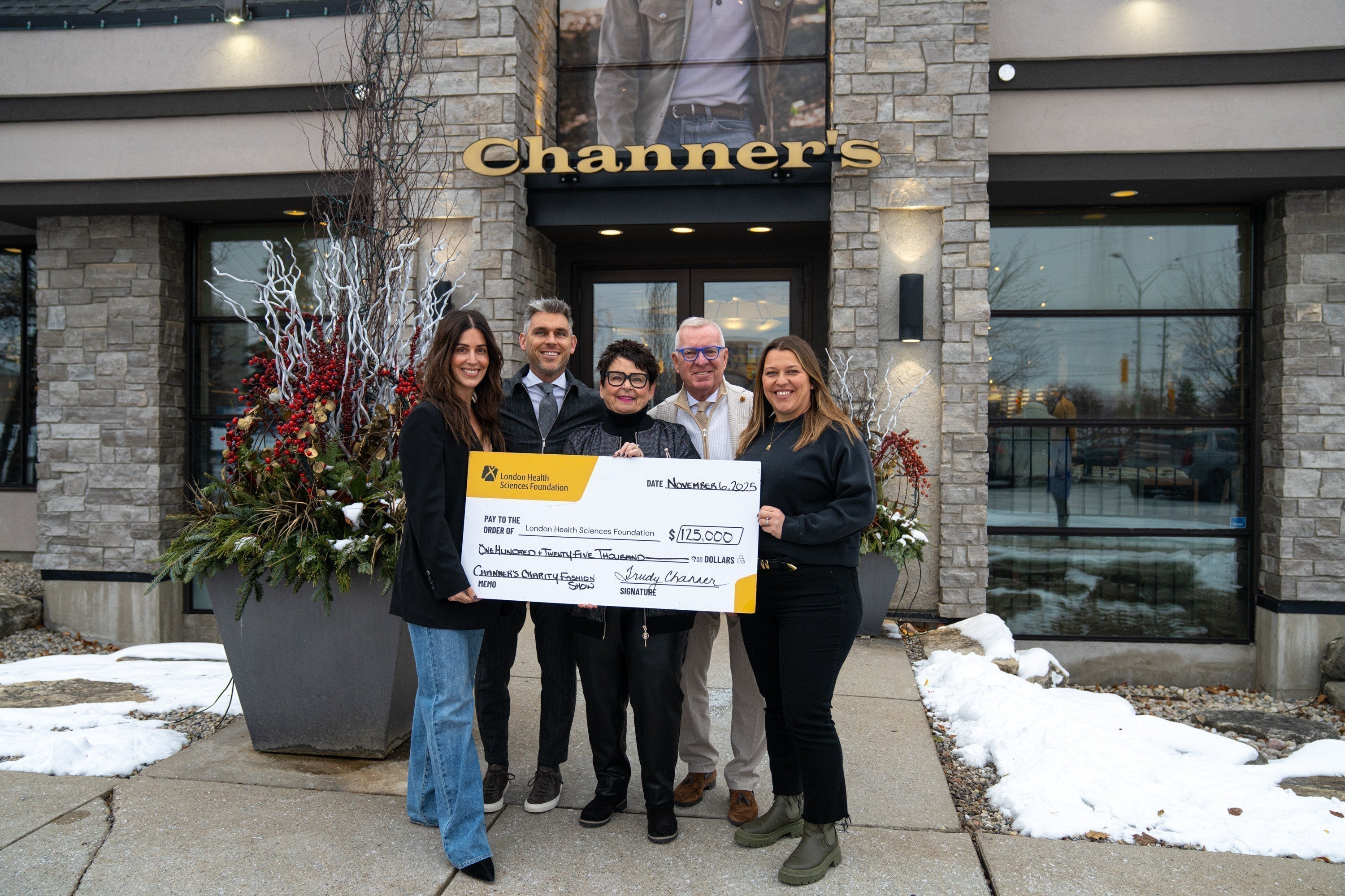 Channer's Team with check form charity event